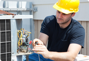young-tradesmen-working-on-air-conditioner